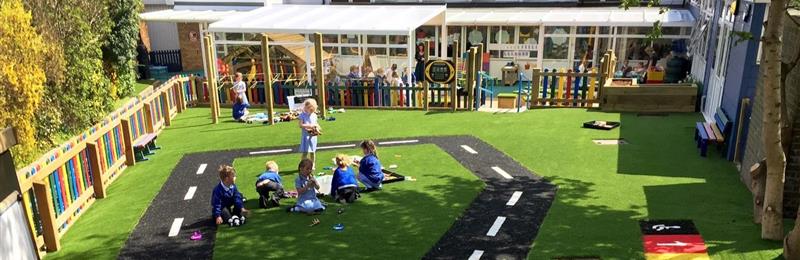 Outdoor classroom with play roadway on astroturf